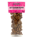 A bag of candied pecans in a clear bag with a pink label on top.
