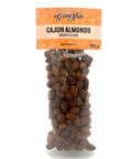 A clear bag of spiced almonds with an orange label on top.