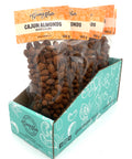 5 clear bags of spiced almonds with orange labels on top.