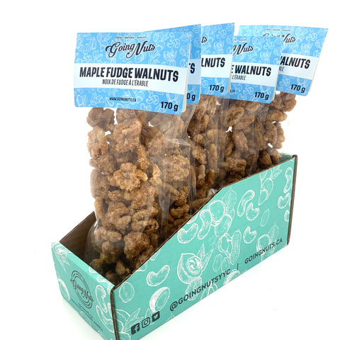 5 bags of candied walnuts in clear bags with light blue labels on top.