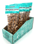 5 bags of candied almonds in clear bags with turquoise labels on top.