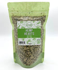 A green zippered bag filled with hemp hearts with a clear front and a green and white label on the front