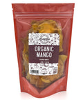 A pink bag with a clear front is filled with dried organic mango with a white and pink label on the front.
