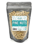 A black zippered bag filled with pine nuts with a clear front and a teal and white label on the front