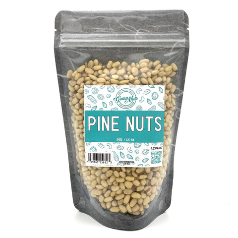 A black zippered bag filled with pine nuts with a clear front and a teal and white label on the front