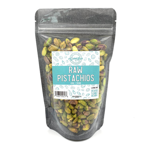 A black zippered bag filled with pistachios with a clear front and a teal and white label on the front