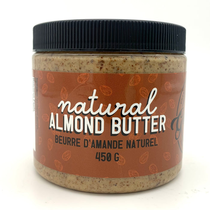 A jar of nut butter with a brown label which has an almond motif. 