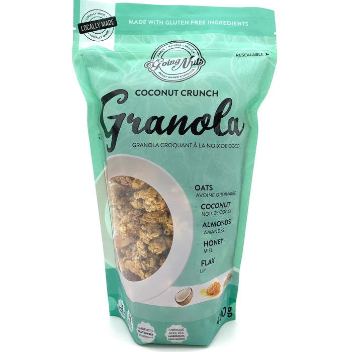 A teal zippered bag which has a window in the shape of a circle to reveal the granola underneath; a clustered mix of oats, coconut, and almonds.