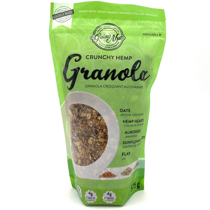 A green zippered bag which has a window in the shape of a circle to reveal the granola underneath; a mix of oats, sunflower seeds, and hemp.