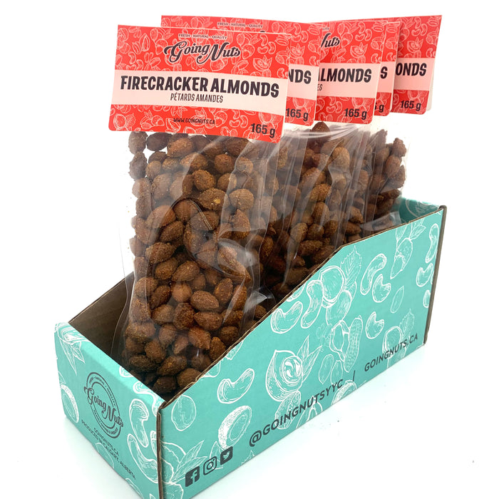 5 clear bags of spiced almonds with red labels on top.