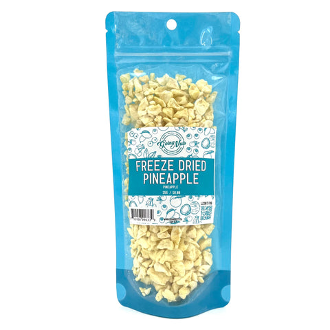 A blue bag full of small pieces of yellow freeze-dried pineapple. 