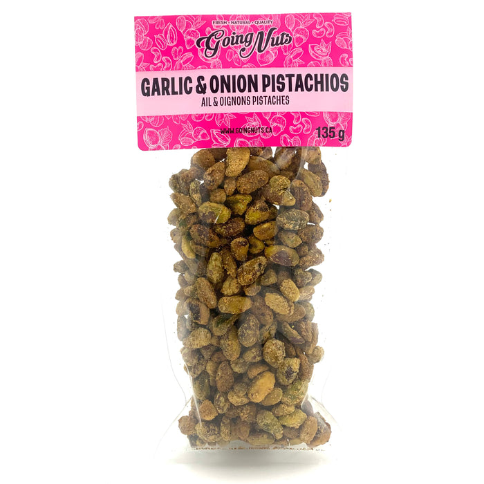A clear bag of spiced pistachios with a pink label on top.