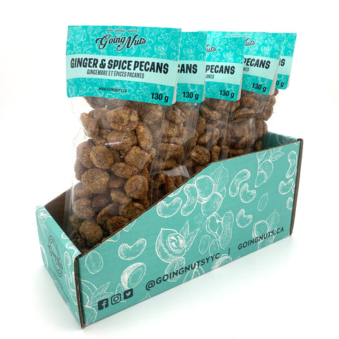 5 clear bags of candied pecans with turquoise labels on top.