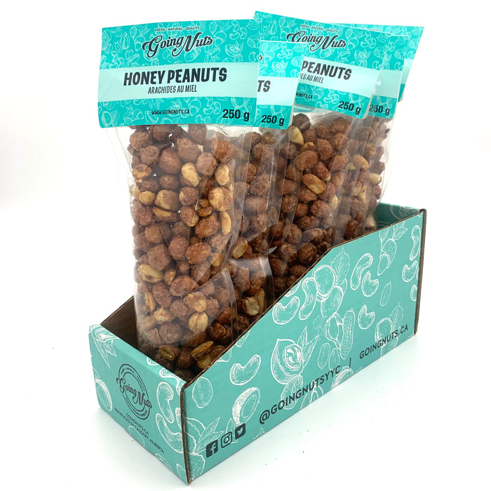 5 bags of candied peanuts in clear bags with turquoise labels on top.