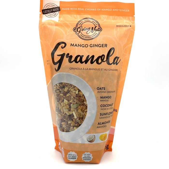 An orange zippered bag which has a window in the shape of a circle to reveal the granola underneath; a mix of oats, pumpkin seeds, and mango.