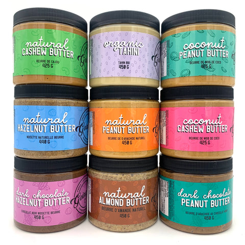 Three stacks of three jars of nut butters, all labeled with colourful labels.