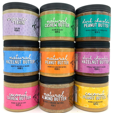 9 jars of various nut butters stacked in 3 stacks of 3, all with colourful labels