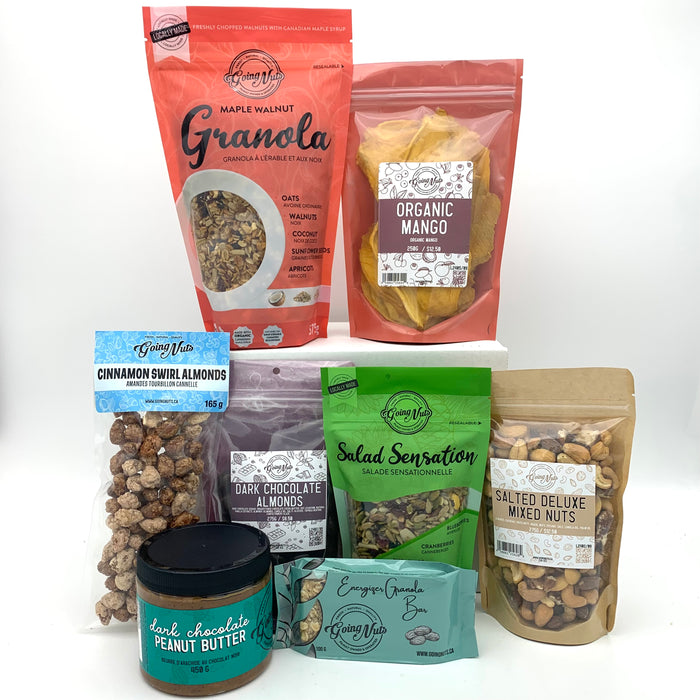 A colourful mix of various bags of nuts, mixes, granola and granola bar and a jar of peanut butter.