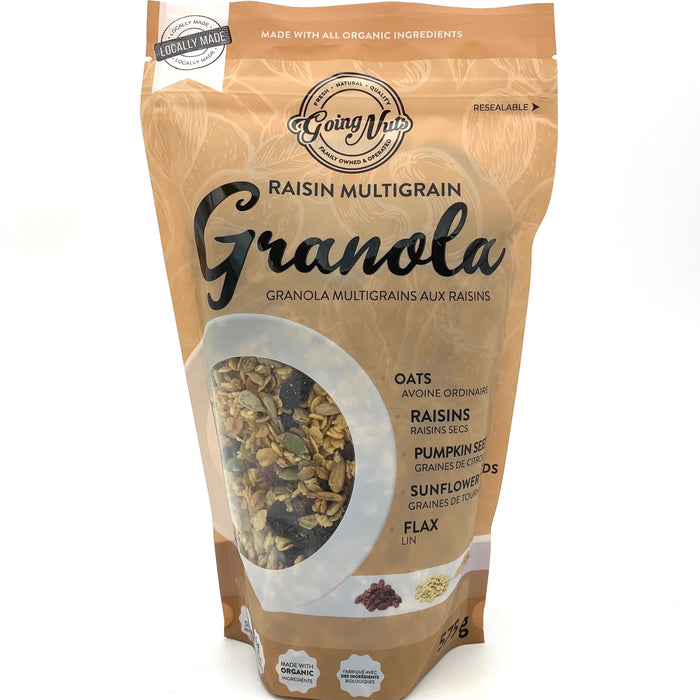 A brown zippered bag which has a window in the shape of a circle to reveal the granola underneath; a mix of oats, raisins, and pumpkin seeds.