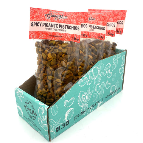 5 clear bags of spiced pistachios with red labels on top.