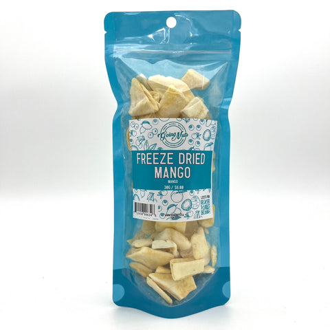 A bright blue bag with a clear front is filled with freeze-dried mango with a white and blue label on the front.