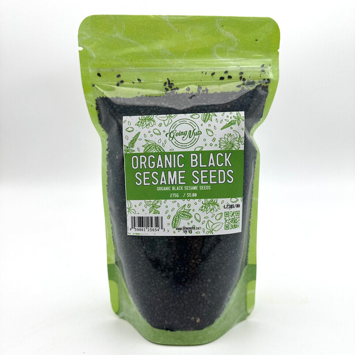 A green zippered bag filled with black sesame seeds with a clear front and a green and white label on the front