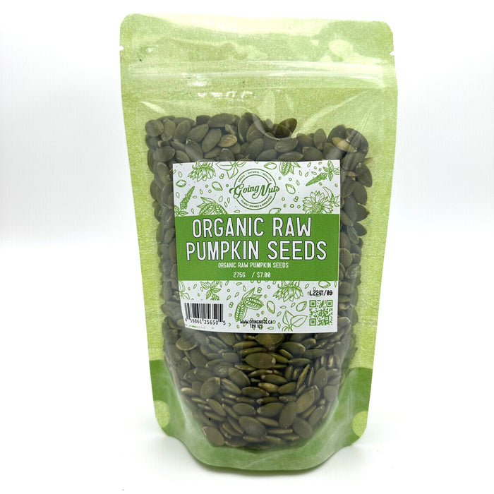 A light green zippered bag filled with organic raw pumpkin seeds with a clear front and a green and white label on the front