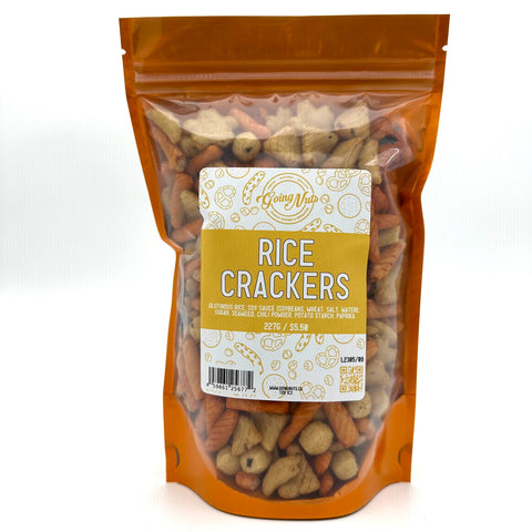 An orange bag with a clear front is filled with rice crackers with a white and orange label on the front 