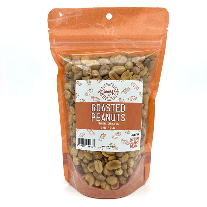 An orange bag with a clear front is filled with roasted peanuts with a white and orange label on the front 