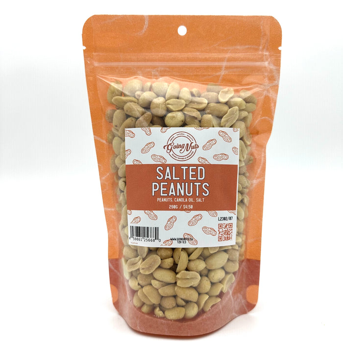 An orange bag with a clear front is filled with salted peanuts with a white and orange label on the front 